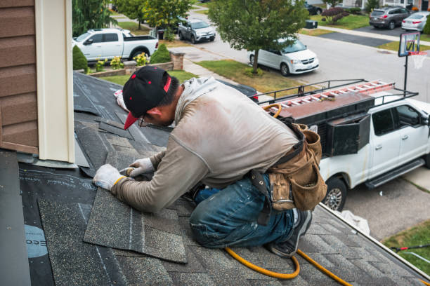 Professional Emergency Roof Repair technician working in Manistee, MI